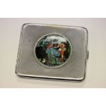 A white metal cigarette case with butterfly wing and reverse painted idyllic courting couple