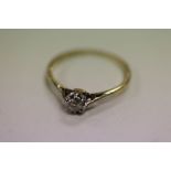 An early 20th C Gold & Diamond solitaire ring approx 0.2cts, set in white & yellow stamped '
