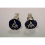 A pair of silver and enamel set masonic cufflinks