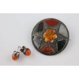 An early 20th Scottish style agate silver target brooch, the centre paste stone with engraved star