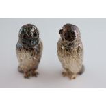 A pair of novelty silver owl salt and pepper pots, London 1976, makers Da-Mar, modelled in