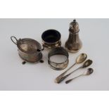 An unassociated three piece silver cruet comprising salt, pepper and mustard with blue glass liners,