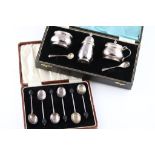 A 20th century cased silver three piece cruet set with salt and mustard spoons, cauldron shaped salt