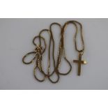 A 9ct yellow gold crucifix on 9ct gold chain, chain length approximately 60 cm