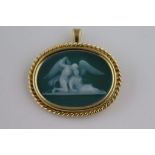 A pâte-sur-pâte green ground 18ct yellow gold oval pendant brooch, depicting classical Archangel and