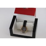 A boxed Gents Tissot 1853 wristwatch, with original label, black dial with gilt baton numerals and