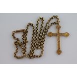 A Victorian 9ct yellow gold crucifix pendant, bright cut scroll decoration, approximately 37mm by