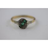 An Art Deco emerald and diamond 18ct yellow gold platinum set ring, the rounded rectangular head