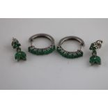 A pair of emerald silver stylised leaf drop stud earrings, marquise shaped and round mixed cut