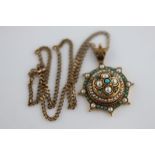 A late Victorian/Edwardian Etruscan style turquoise and seed pearl 9ct yellow gold stepped target