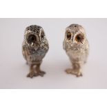 A pair of novelty silver owl salt and pepper pots, London 1989 William Comyns & Sons, modelled in