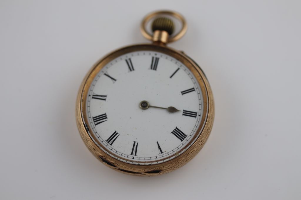 An early 20th century small 9ct gold pocket watch, white enamel dial, black Roman numerals, one hand