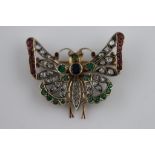 A sapphire, emerald, ruby and diamond 10ct yellow gold butterfly brooch, wings outstretched, the