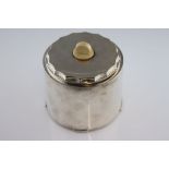 An Art Deco silver biscuit barrel, cylindrical form, four rectangular step feet, semi-circle ivory
