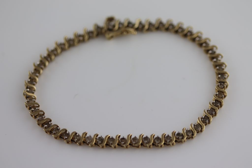 A diamond and yellow gold line bracelet with accompanying eternal impressions certificate stating - Image 3 of 4