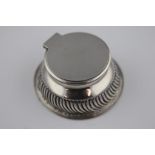 A late Victorian circular silver inkwell, London 1902 John Grinsell & Sons, gadroon decoration to