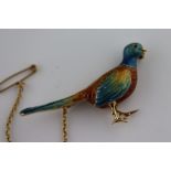 An enamelled 18ct yellow gold realistic pheasant brooch, complete with safety chain, paused mid-walk