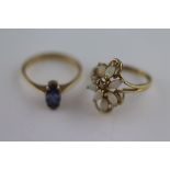 A tanzanite 9ct yellow gold ring, the four claw set marquise mixed cut tanzanite measuring