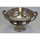 An Edwardian Arts and Crafts style silver twin handled tazza, fiddle scroll handles, tapered foot,