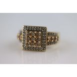 A diamond 9ct yellow gold fancy square shaped cluster ring, nine small round brilliant cut