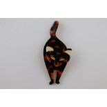 A Lea Stein Bachus cat brooch, tortoiseshell effect colourway, length approximately 10cm, signed