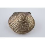 A realistically modelled novelty silver clam shell pill box, textured banded shell complete with
