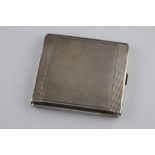 An Art Deco continental silver cigarette case, engine turned decoration with incised linear line