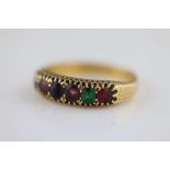 A mutli gem set six stone 18ct yellow gold 'regard' ring, ruby, emerald, garnet, ruby, diamond,