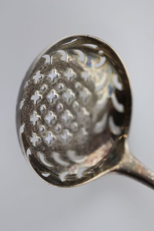 A William IV silver tea strainer, London 1835 Solomon Houghman, engraved horse head over crown crest - Image 2 of 3