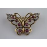 A ruby and diamond 9ct yellow gold and white gold set butterfly brooch, openwork wings