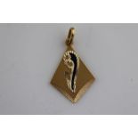 An enamelled 18ct yellow gold pendant, kite shaped with applied flared and enamelled decoration,