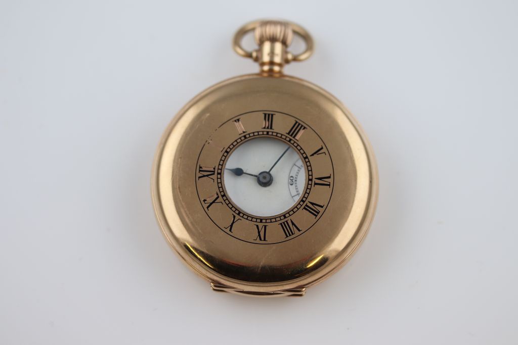 A Rolex fifteen jewel 9ct yellow gold half hunter pocket watch, unsigned white enamel dial and