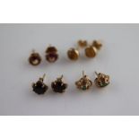 Four pairs of gem set 9ct gold stud earrings to include cabochon cut citrine, garnet, emerald etc