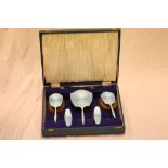 A cased George V enamelled silver five piece brush set, sky blue guilloche enamel, Birmingham