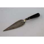 A black onyx handled silver trowel bookmark, London 1986, Ari D Norman, length approximately 7.5cm