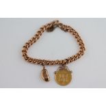 A 9ct rose gold curb link charm bracelet with 9ct rose gold kidney bead charm and mounted