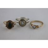 Two 9ct yellow gold paste set rings together with a pale blue topaz silver ring, ring sizes M, N and
