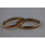 A 9ct rose gold wedding band, band width approximately 2mm, ring size L, together with a 9ct