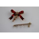 A late Victorian/Edwardian enamelled 9ct rose gold bow brooch with toggle, red enamelling, bow