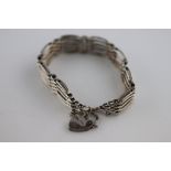 A silver gate link padlock clasp bracelet, Birmingham 1979, makers initials AWW, width approximately