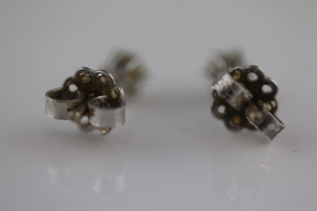 A pair of diamond solitaire white metal stud earrings, each round brilliant cut diamond weighing - Image 3 of 3