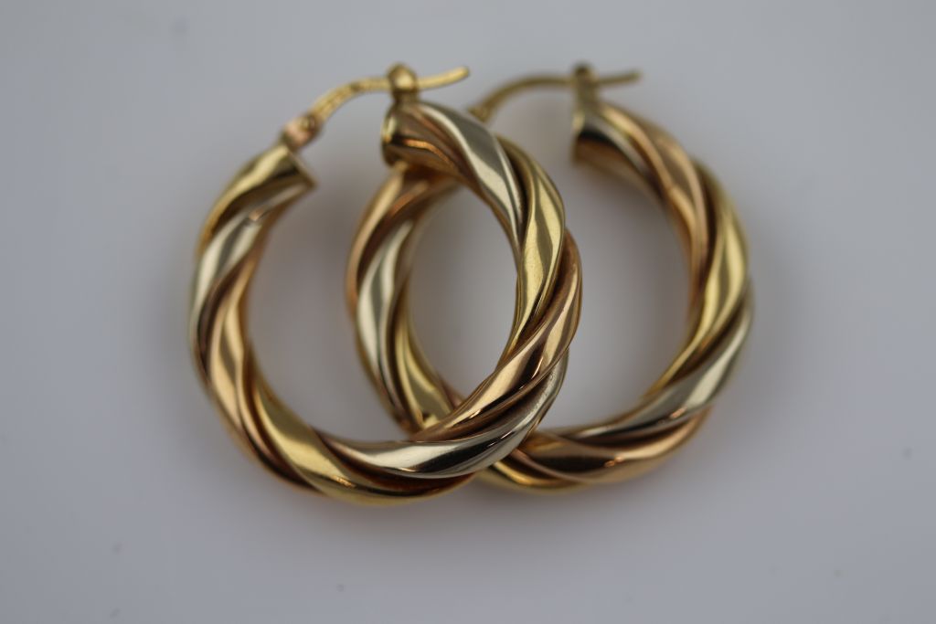 A pair of unmarked gold twisted hoop earrings, subtle tri-colour gold finish, diameter - Image 4 of 7