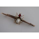 A late Victorian/Edwardian moonstone and paste 9ct rose gold insect bar brooch in the form of a