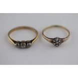 An early 20th century three stone diamond unmarked yellow gold platinum set ring, three graduated