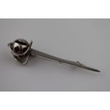 Charles Horner: a George V silver basket hilt sword brooch, the pierced silver handle set with amber