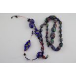 A millefiore graduated glass bead necklace, length approximately 74cm (needs re-stringing)