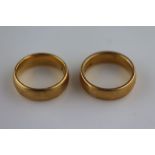 A 22ct yellow gold plain wedding band, band width approximately 5mm, ring size I, together with