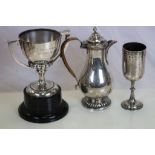 An Edwardian silver presentation coffee pot raised of reeded foot, with inscription "Presented to