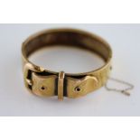 A Victorian 9ct yellow gold buckle hinged bracelet, re-assayed with modern hallmark, complete with