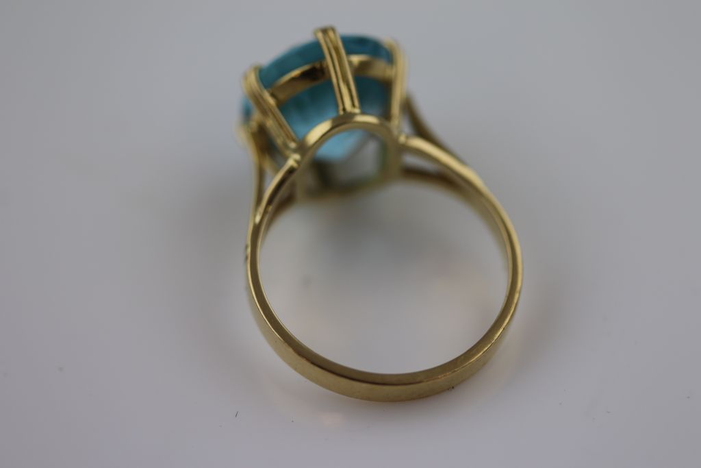 A blue topaz 18ct yellow gold ring, the claw set oval mixed cut blue topaz, measuring approximately - Image 6 of 6